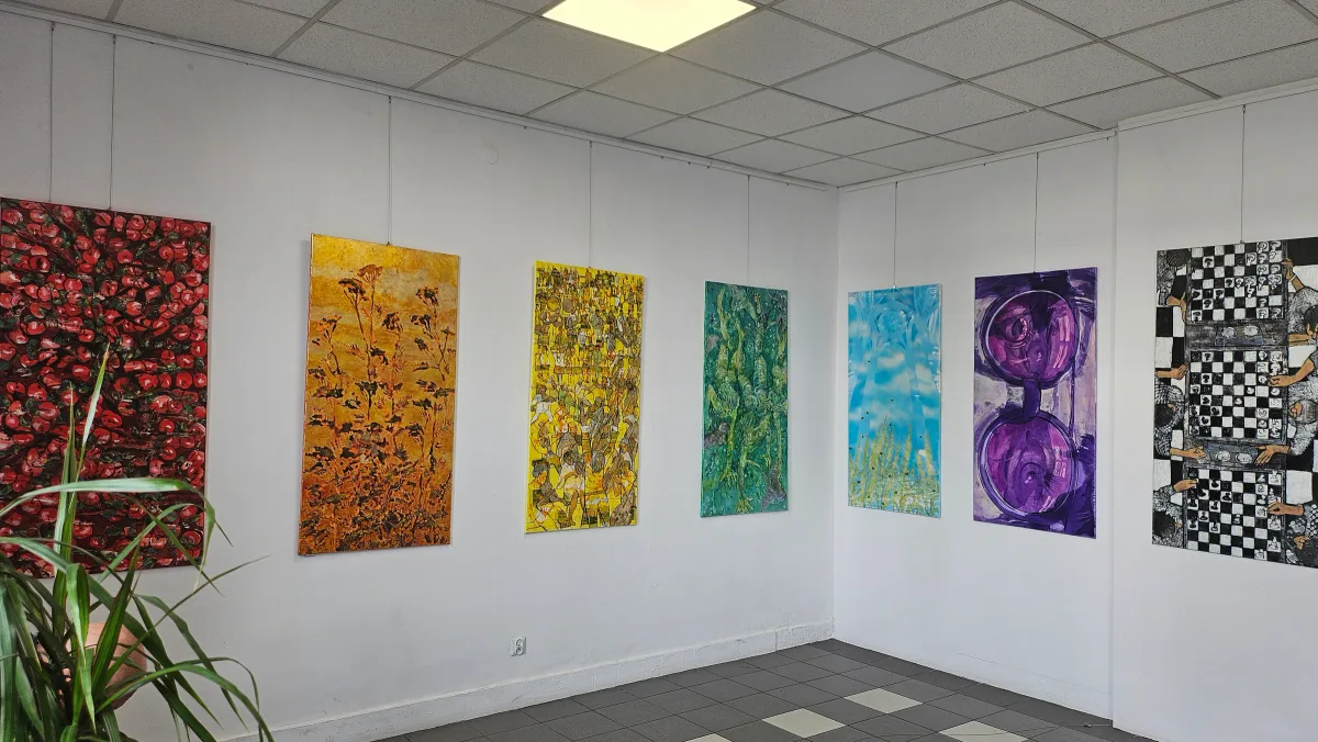 Installation view showing a group of paintings in Między piekłem a niebem at Arteon in Warsaw.